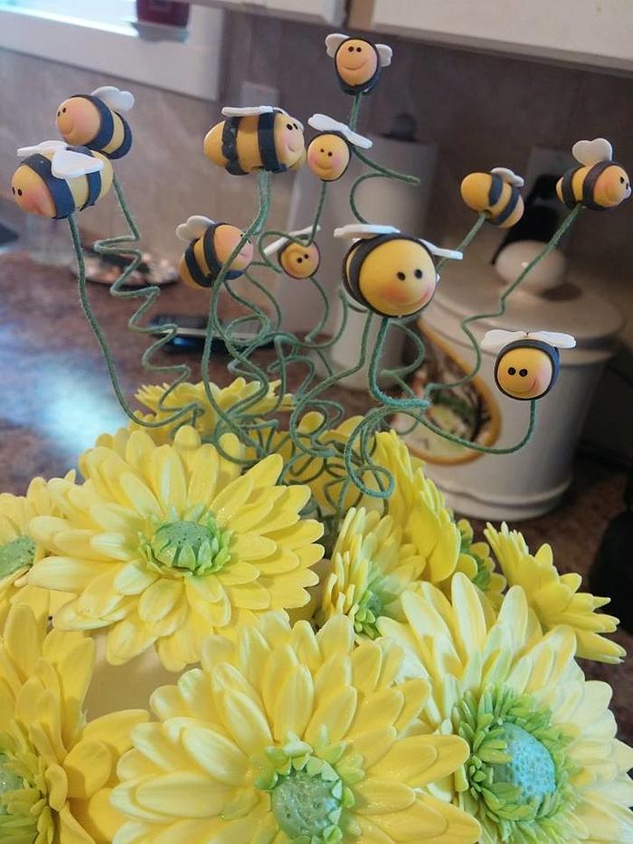 Bees and daisies wedding cake