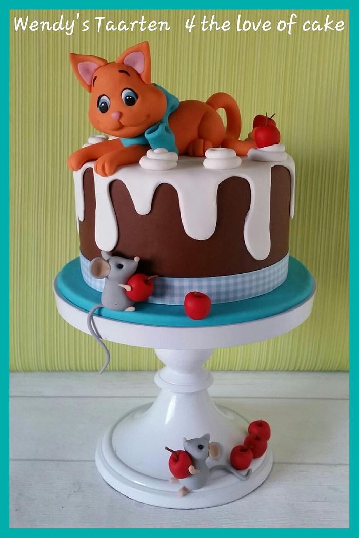 a kitten a cake and some mice 