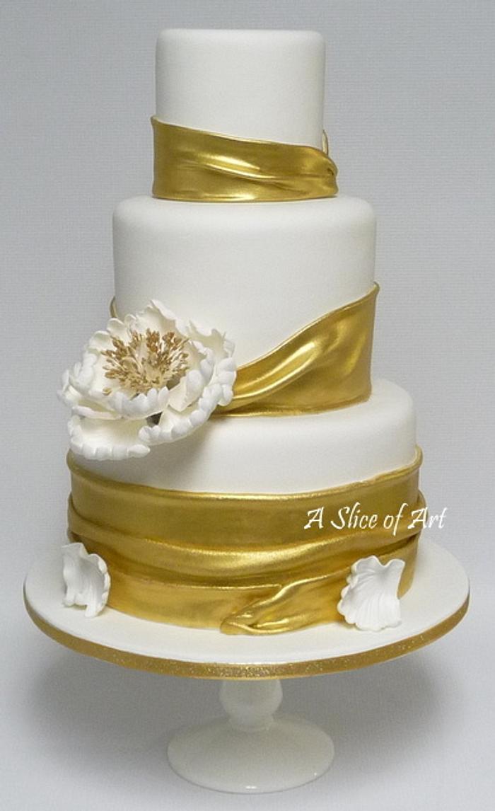 Wrapped gold painted Wedding cake