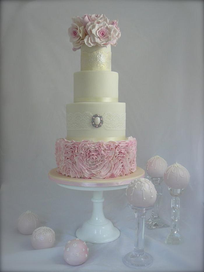Four Tier Ruffle Wedding cake with 10 pretty cakes balls - decorated in royal icing to match the cak