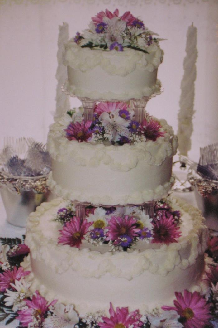 Pink, Lavender and white daisy buttercream wedding cake