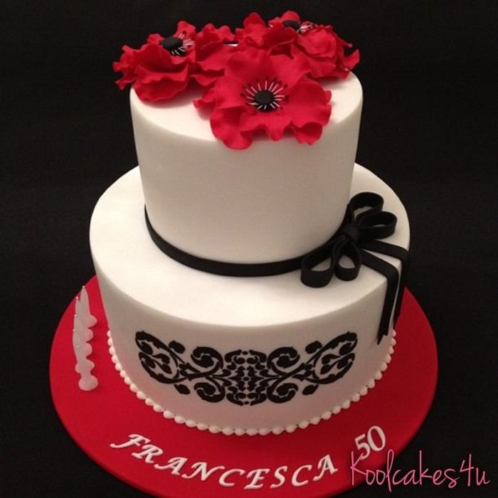 Big red flowers and black stencil cake