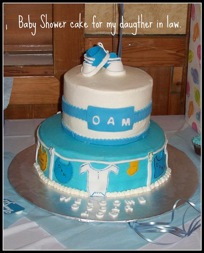 Baby Shower Cake with Baby Initals, Clothesline and gumpaste booties.