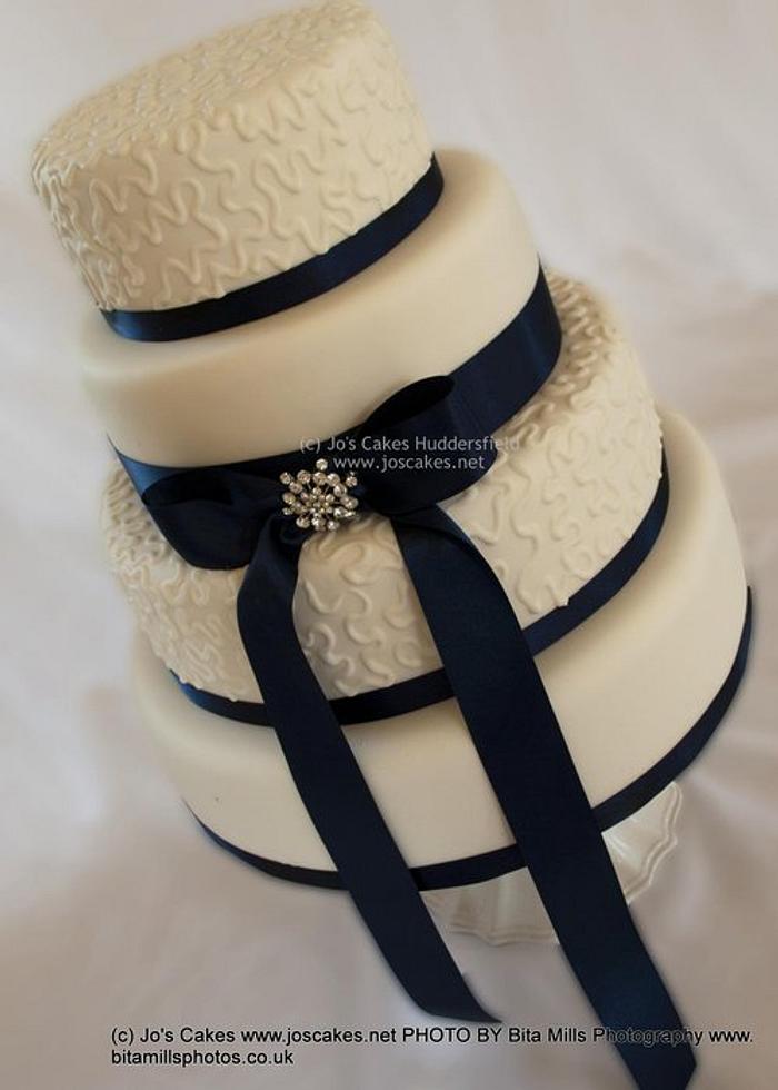 4 Tier Ivory and Navy Blue Wedding Cake