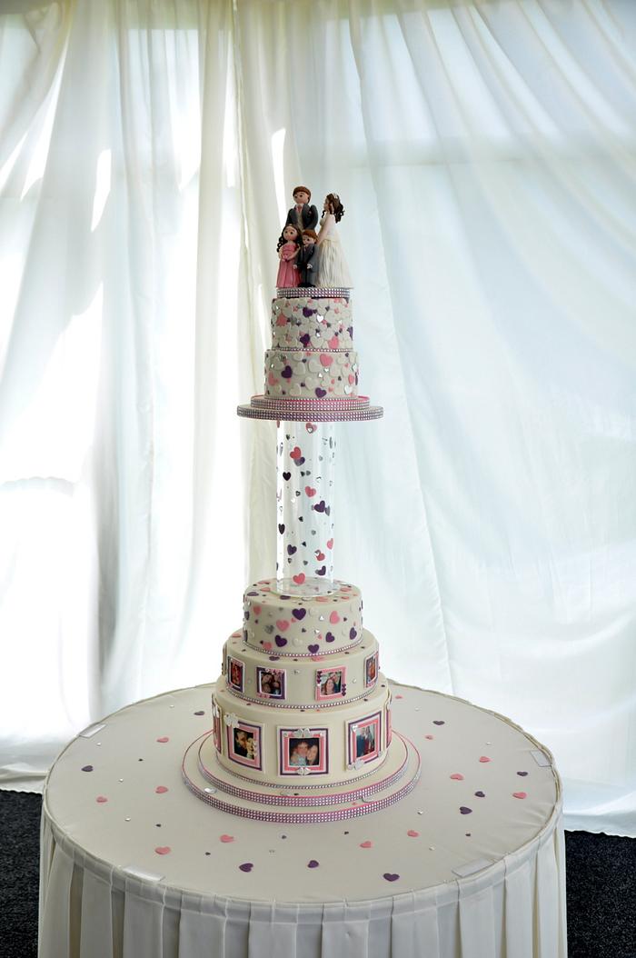 Wedding cake with photos and frames.