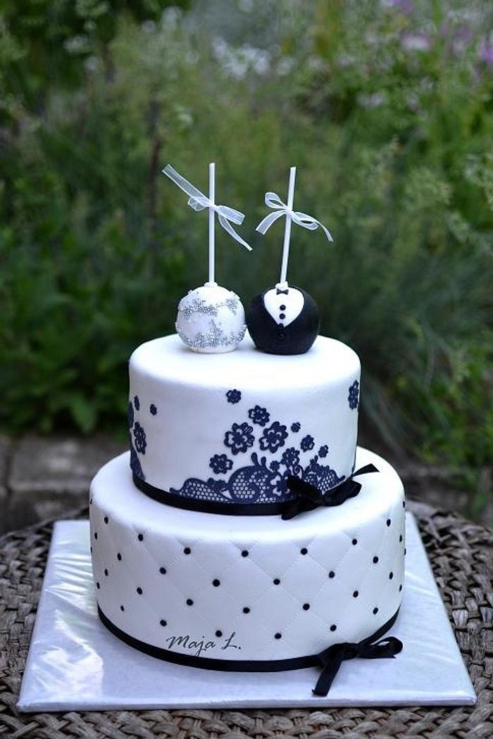 Black and white wedding cake with cake pops