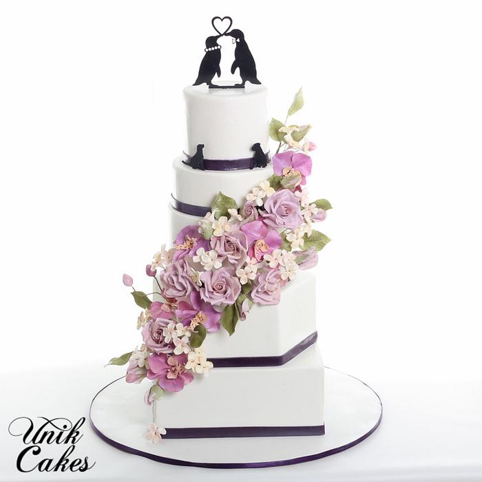 Fall wedding cake with cascading sugar flowers.