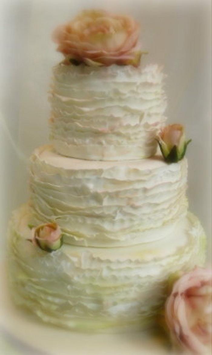 Ivory ruffled wedding cake
