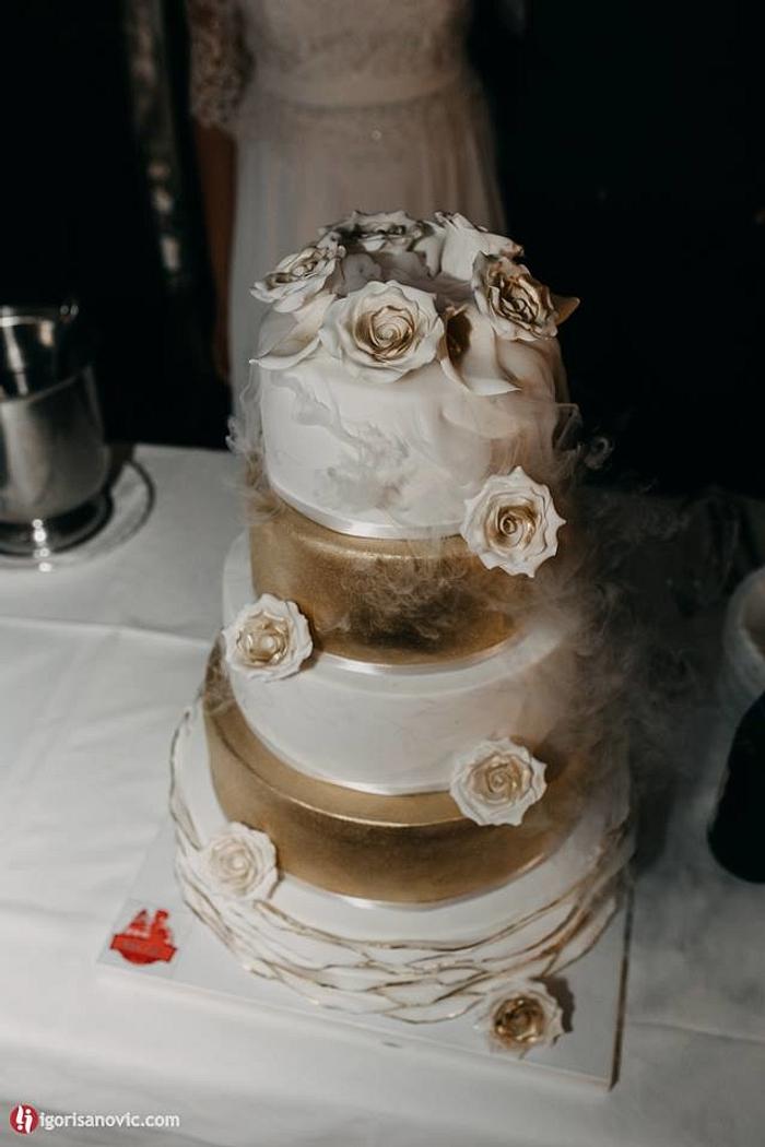 Gold white dry ice wedding cake