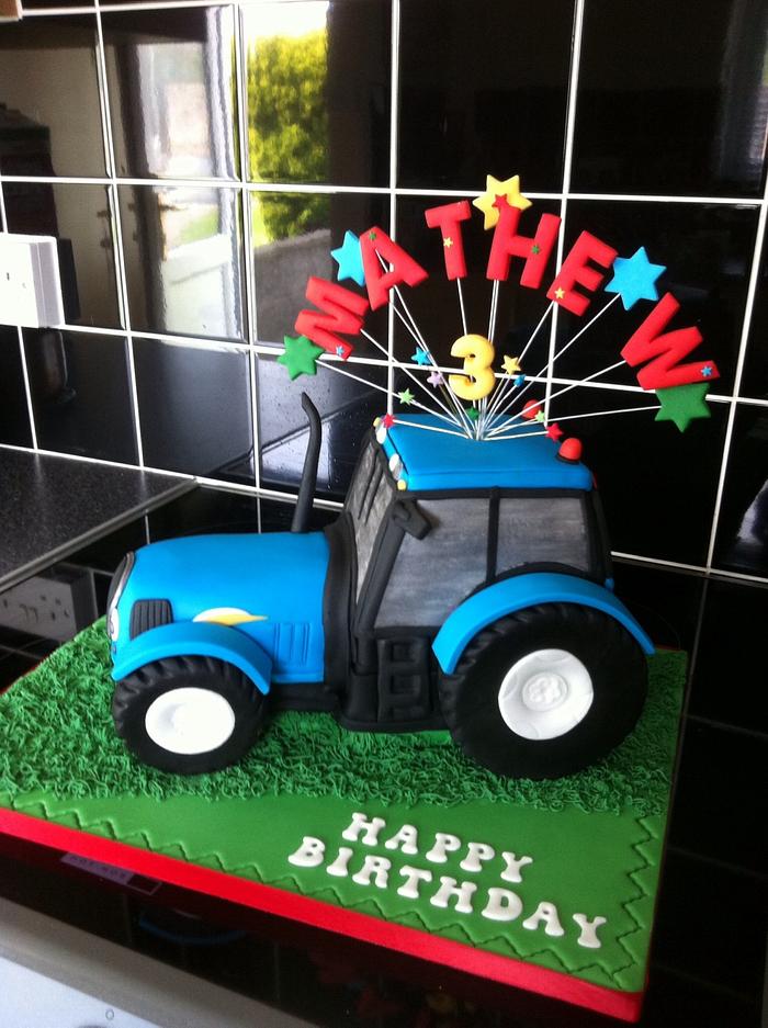 Blue tractor cake with wired name topper!