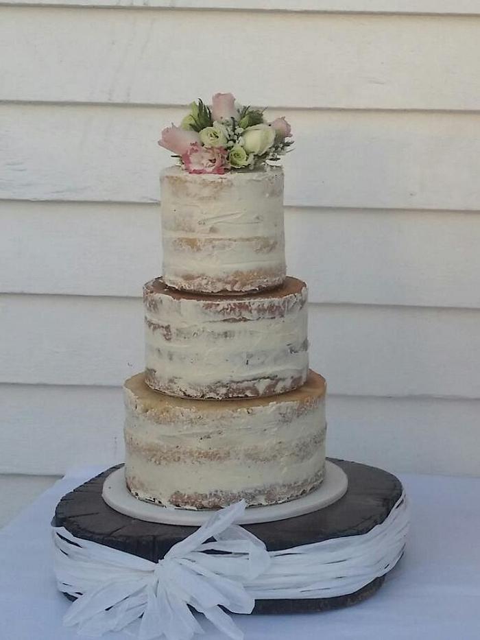 Semi naked three tier wedding cake