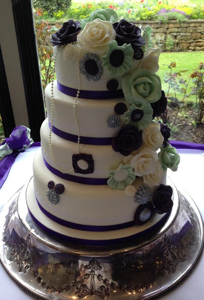 Buttons and floral wedding cake
