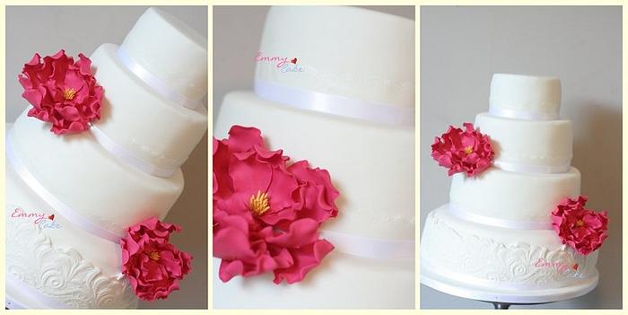 Modern wedding cake with lace and pink