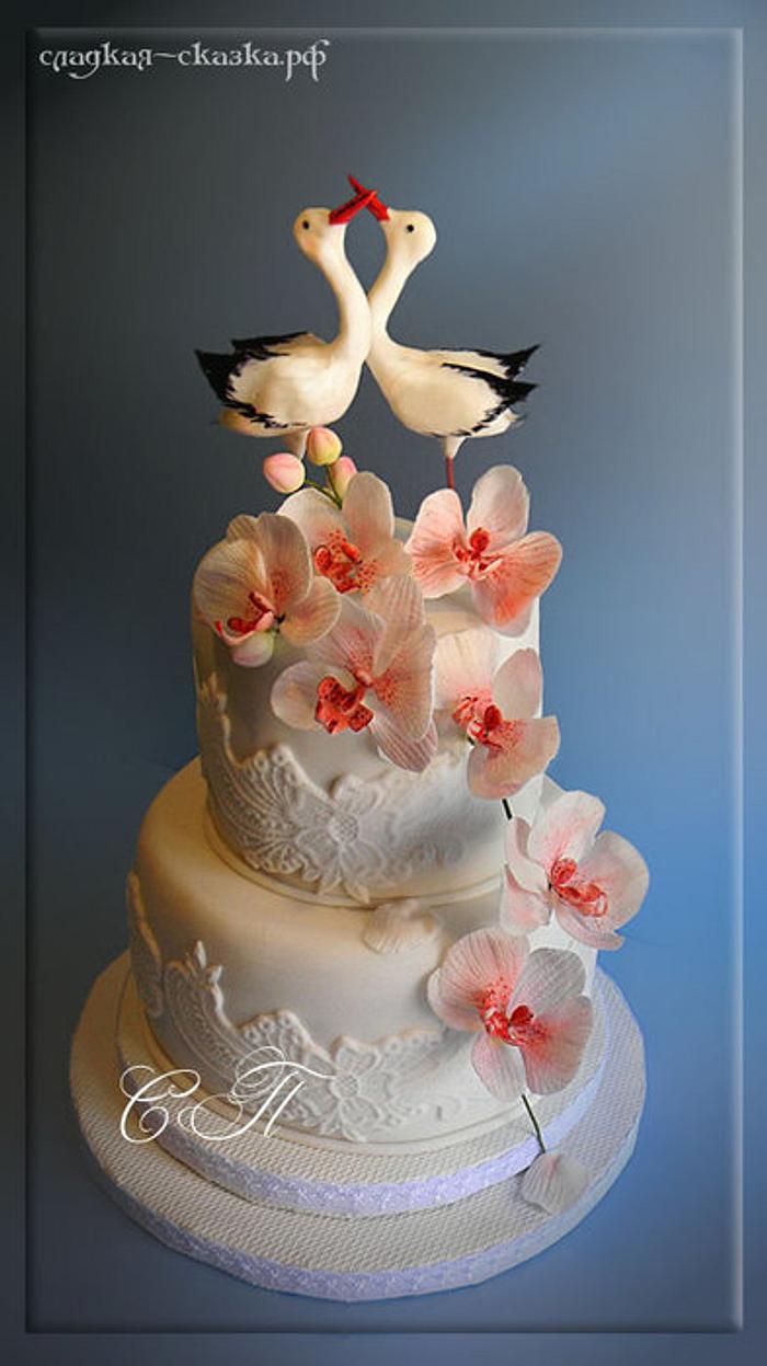 Wedding cake with storks and orchids