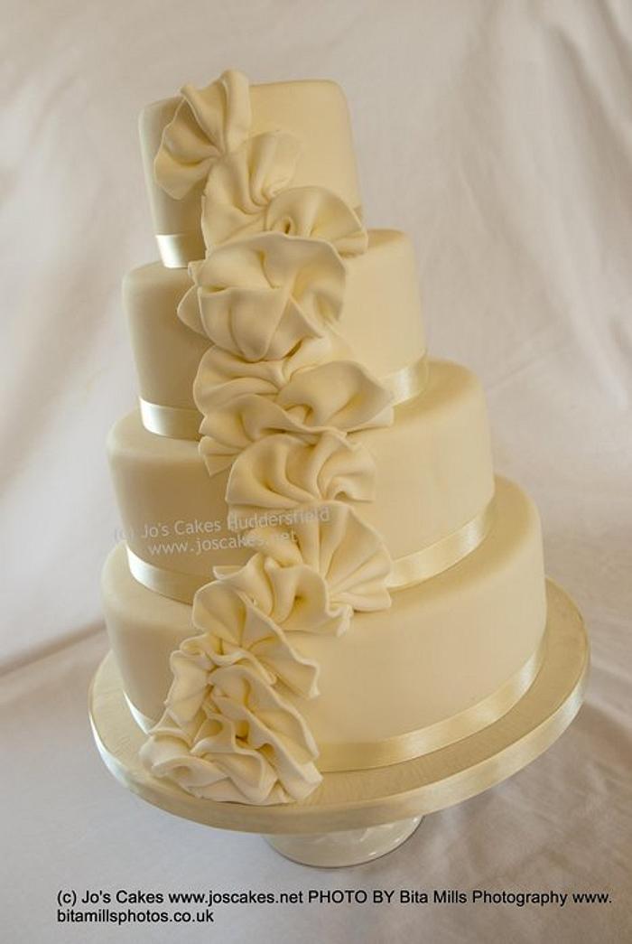4 tier Ivory Ruffles Wedding Cake