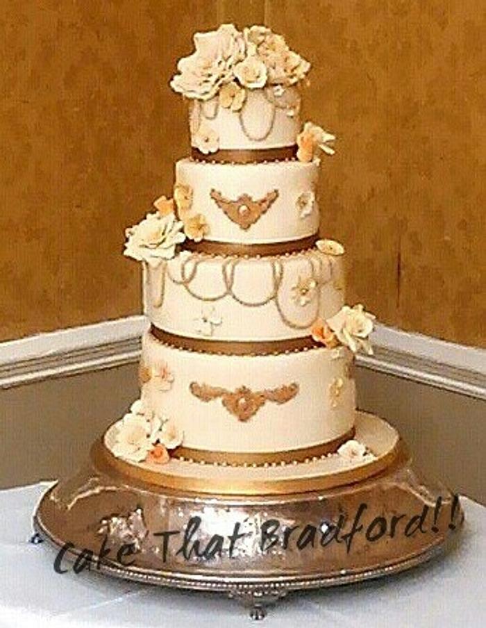 cream and gold wedding cake