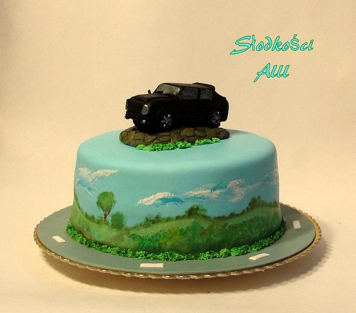 Cake with a statue of the car Range Rover