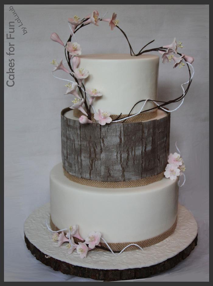 Blossom wedding cake with wood panels