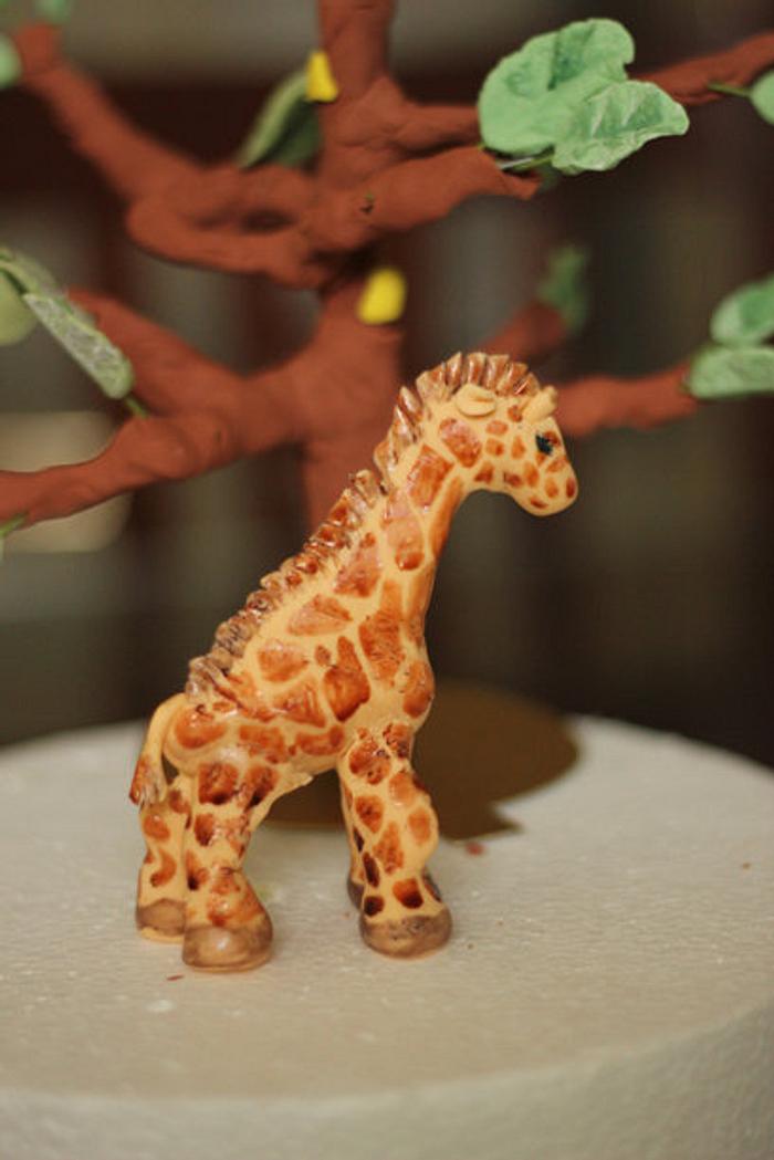 Hand painted gum paste giraffe for a jungle cake