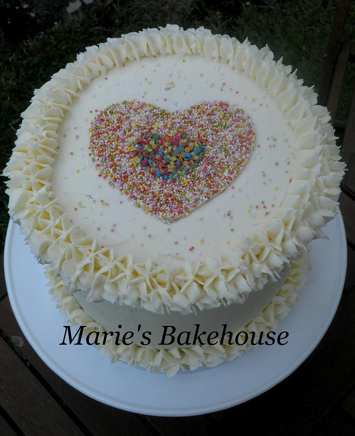 Buttercream cake with sprinkle heart