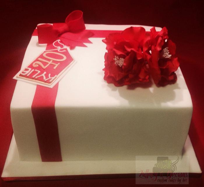 Present cake with red flowers