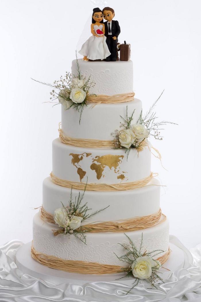 Golden world map wedding cake