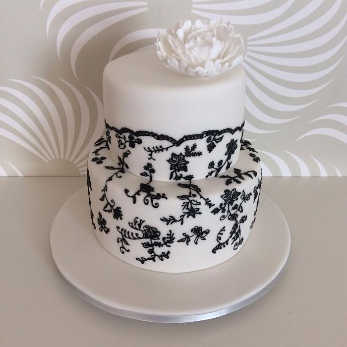 Black & white wedding cake with peony