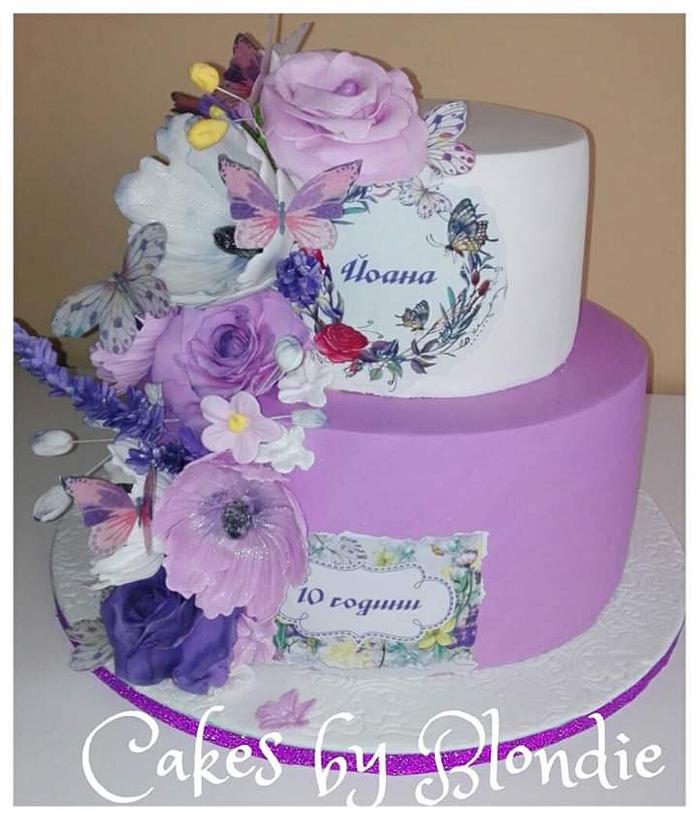 Cake in purple with flowers and butterflies