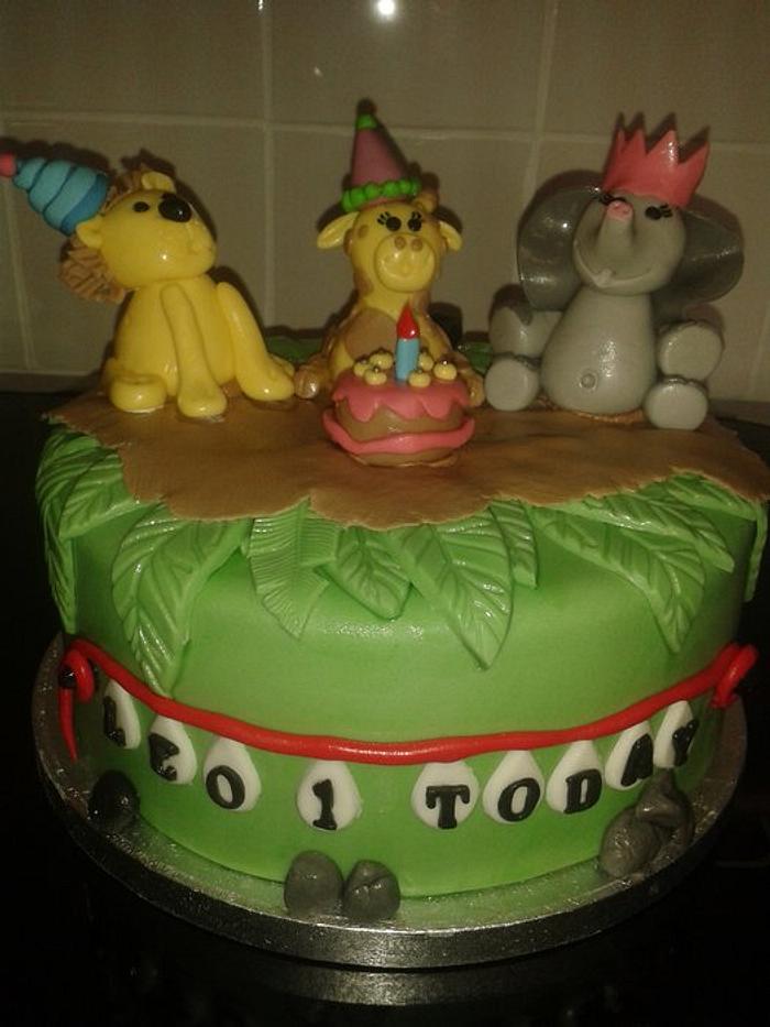 jungle themed cake elephant, giraffe & lion