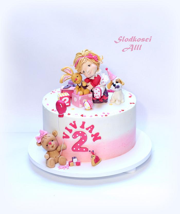 Cute girl in pink cake