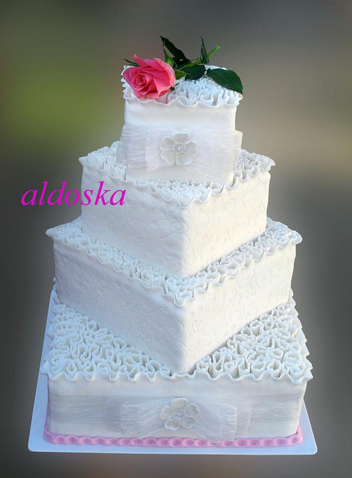 Wedding cake with fresh rose