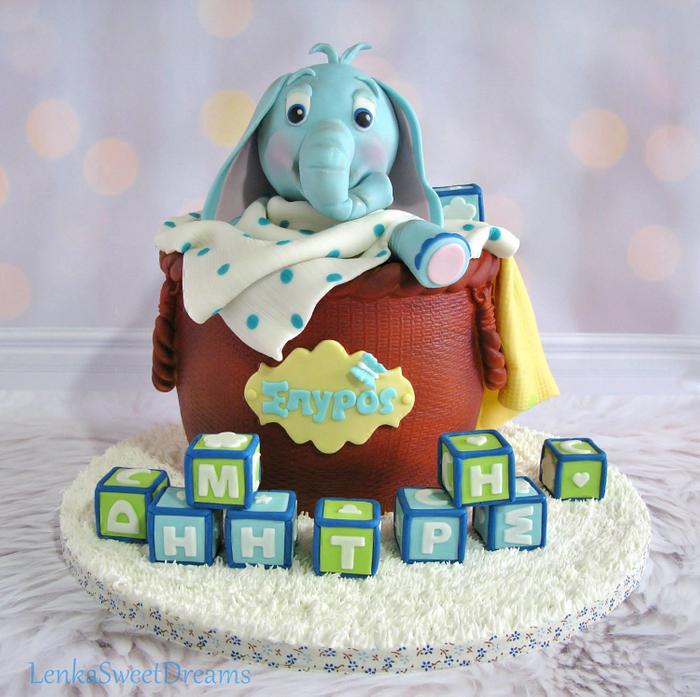 Basket cake with a baby elephant.