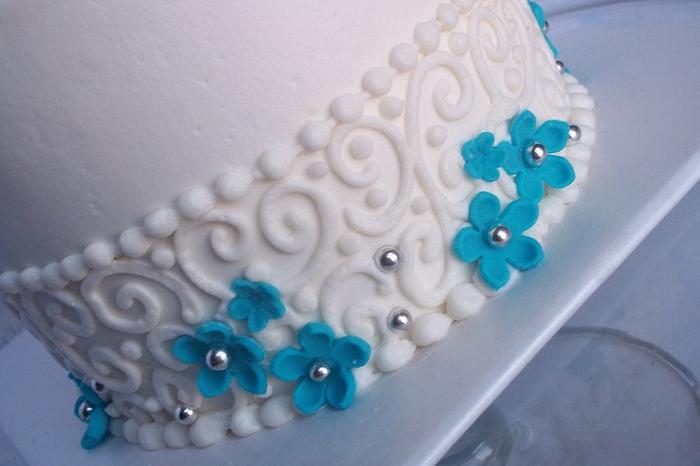 teal blossoms with scrolls