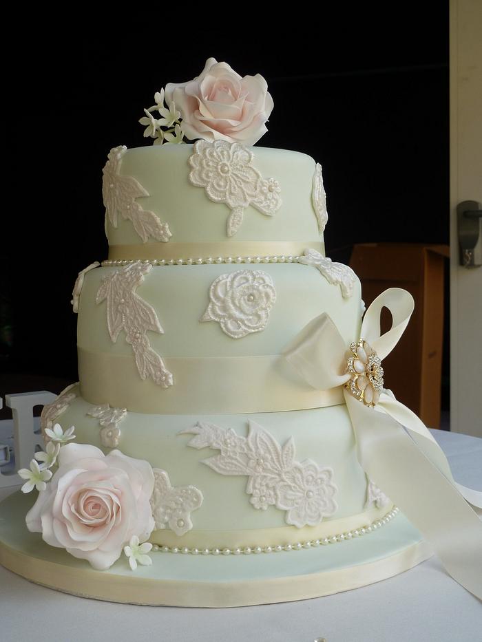 Embossed lace and sugar rose wedding cake