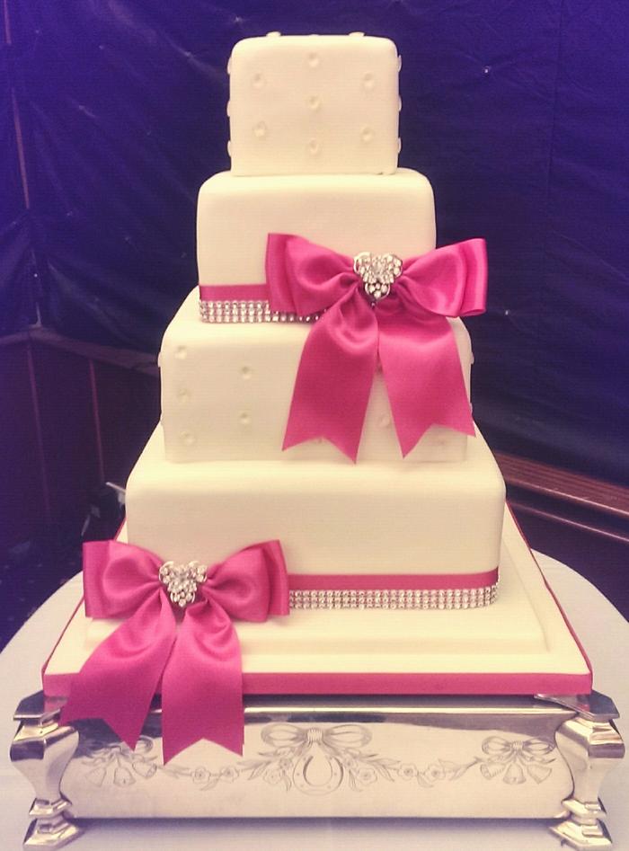 Ivory, Hot pink and diamonte wedding cake