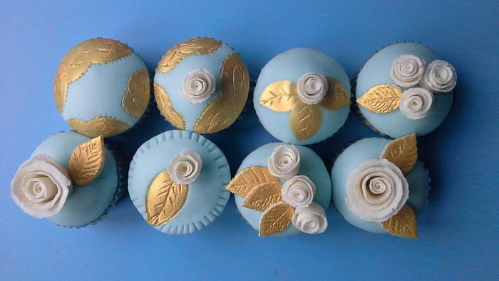 duck egg blue and gold hand painted cupcakes. 