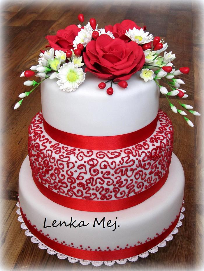 Wedding cake with sugar blossoms in red