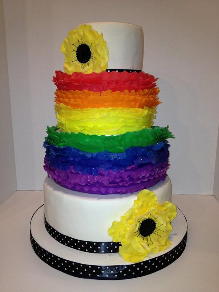 Rainbow frilled wedding cake with fantasy poppies