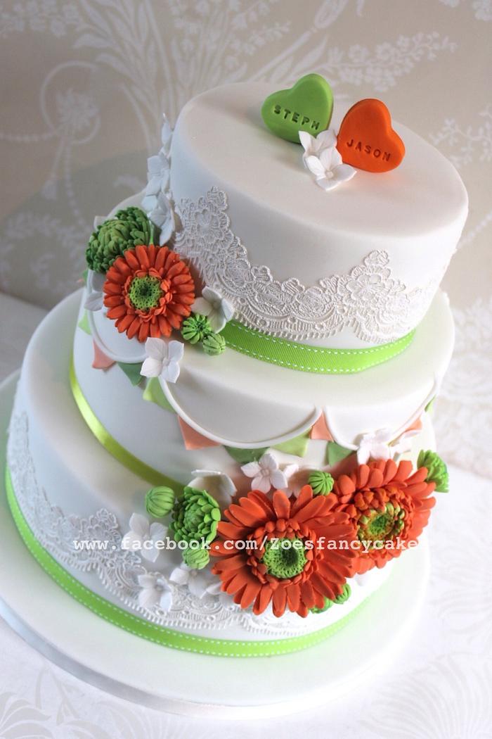 Bright orange and green detailed wedding cake