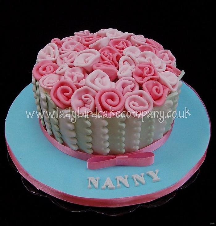 Pastel ribbon rose bouquet cake
