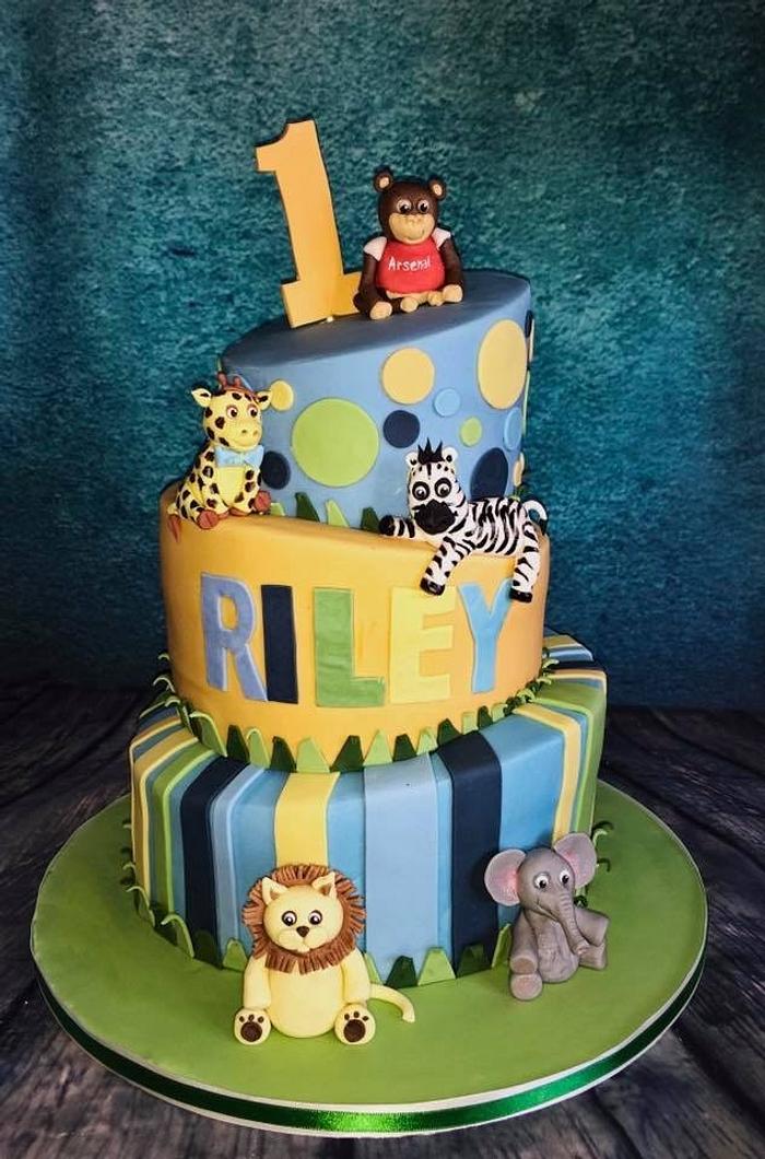 Topsy turvy jungle animals cake