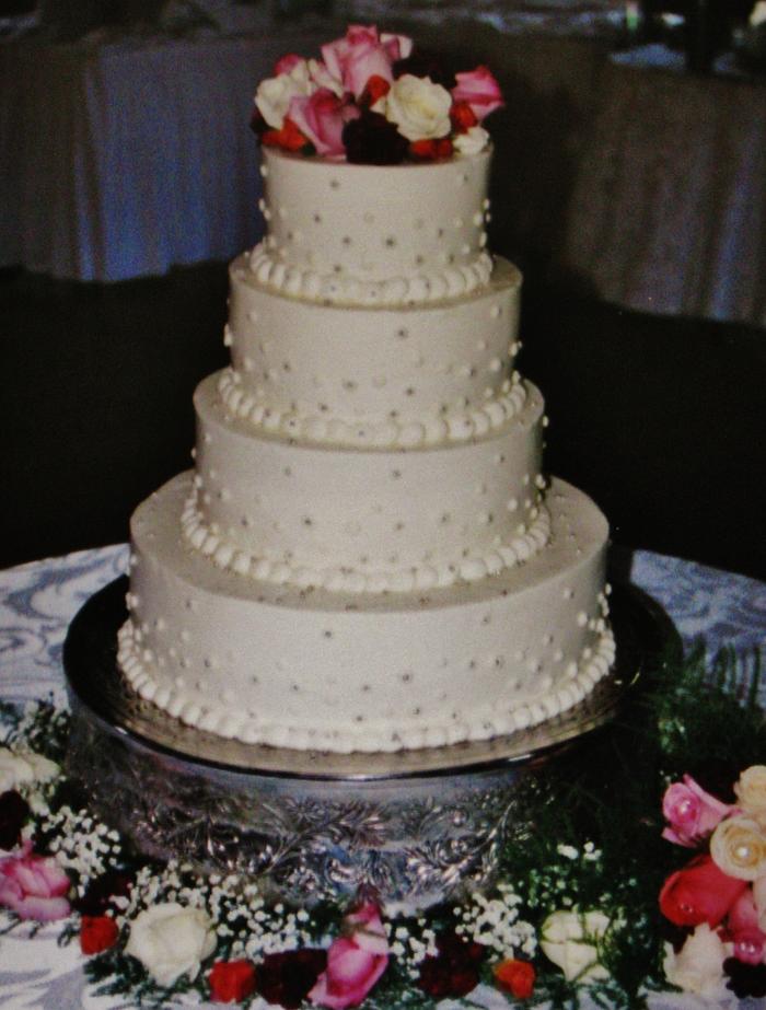 Buttercream and silver dragee dot wedding cake