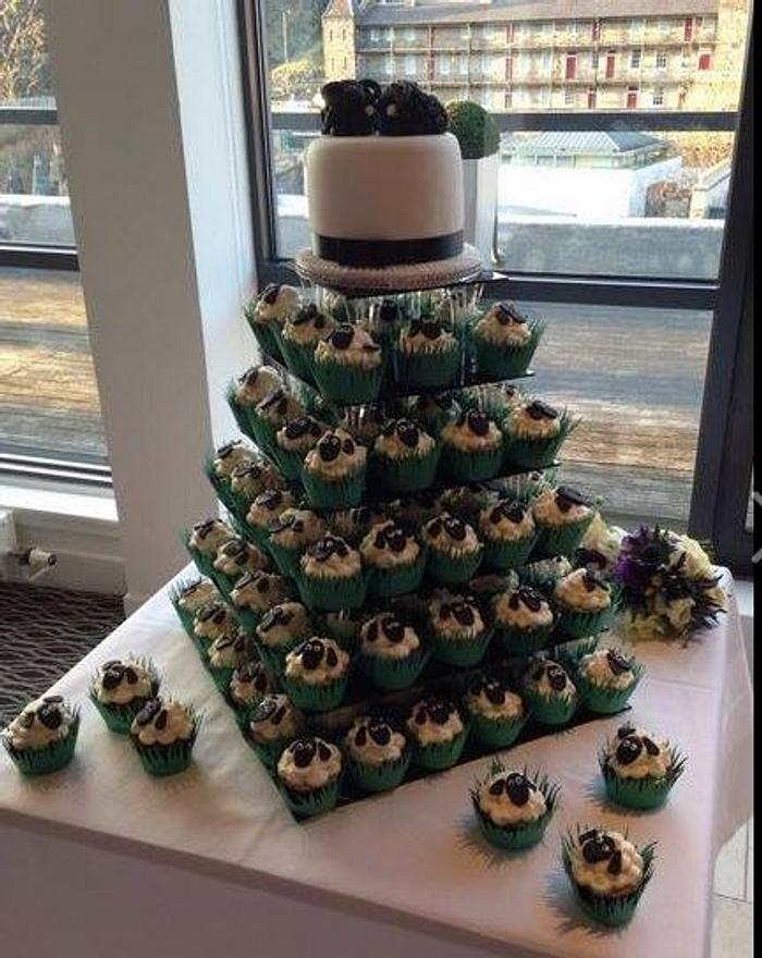 wedding cake tower with sheep style cupcakes 
