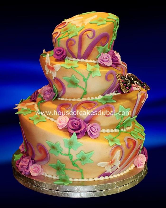 Topsy Turvy cake in gold and purple