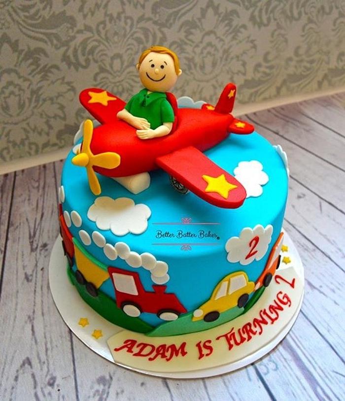 Baby on plane birthday cake