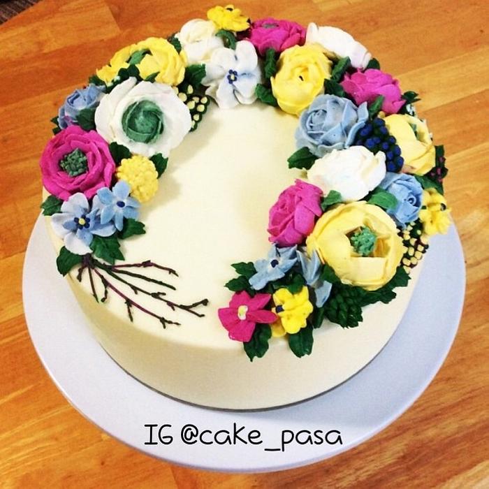 All buttercream cake and flowers.