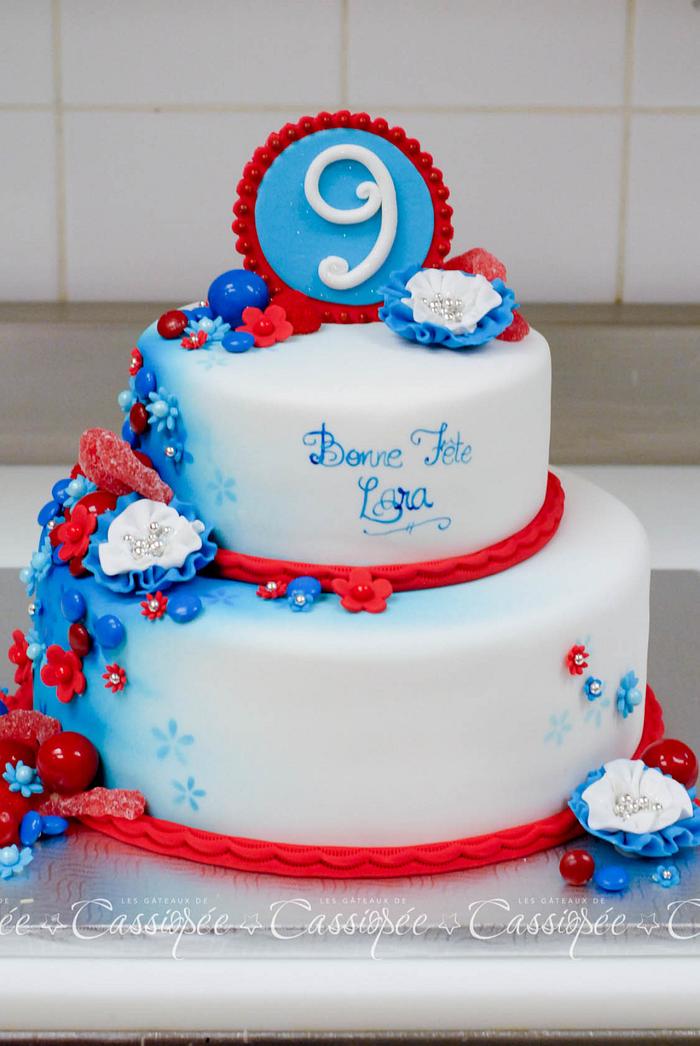 Red and blue sweets and flowers cake