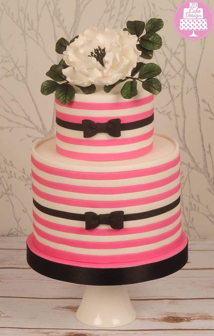 Pink and white striped cake