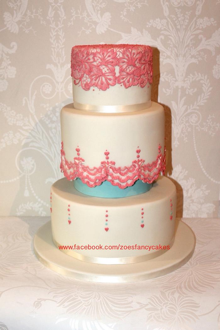Coral and ivory coloured wedding cake