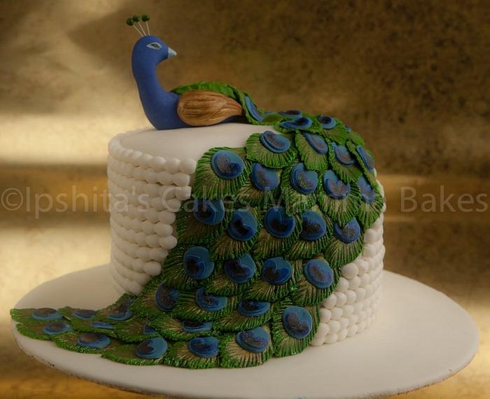 This Incredible Peacock Wedding Cake Uses Cupcakes For The Tail